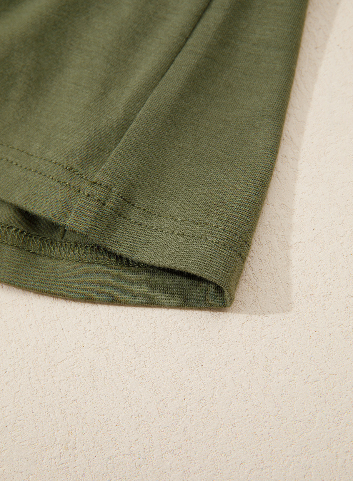 Camiseta tipo peplum con cintura ceñida y mangas 3/4 para uso casual en la oficina