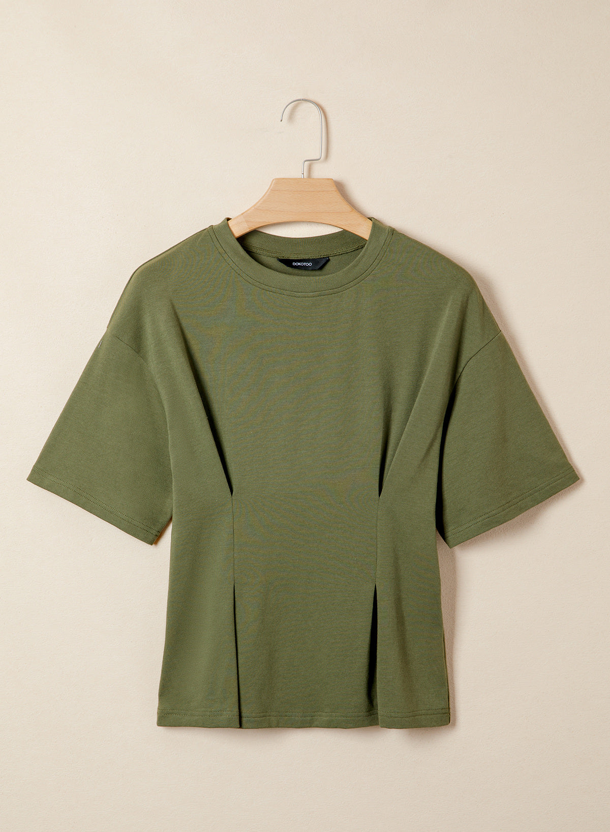 Camiseta tipo peplum con cintura ceñida y mangas 3/4 para uso casual en la oficina