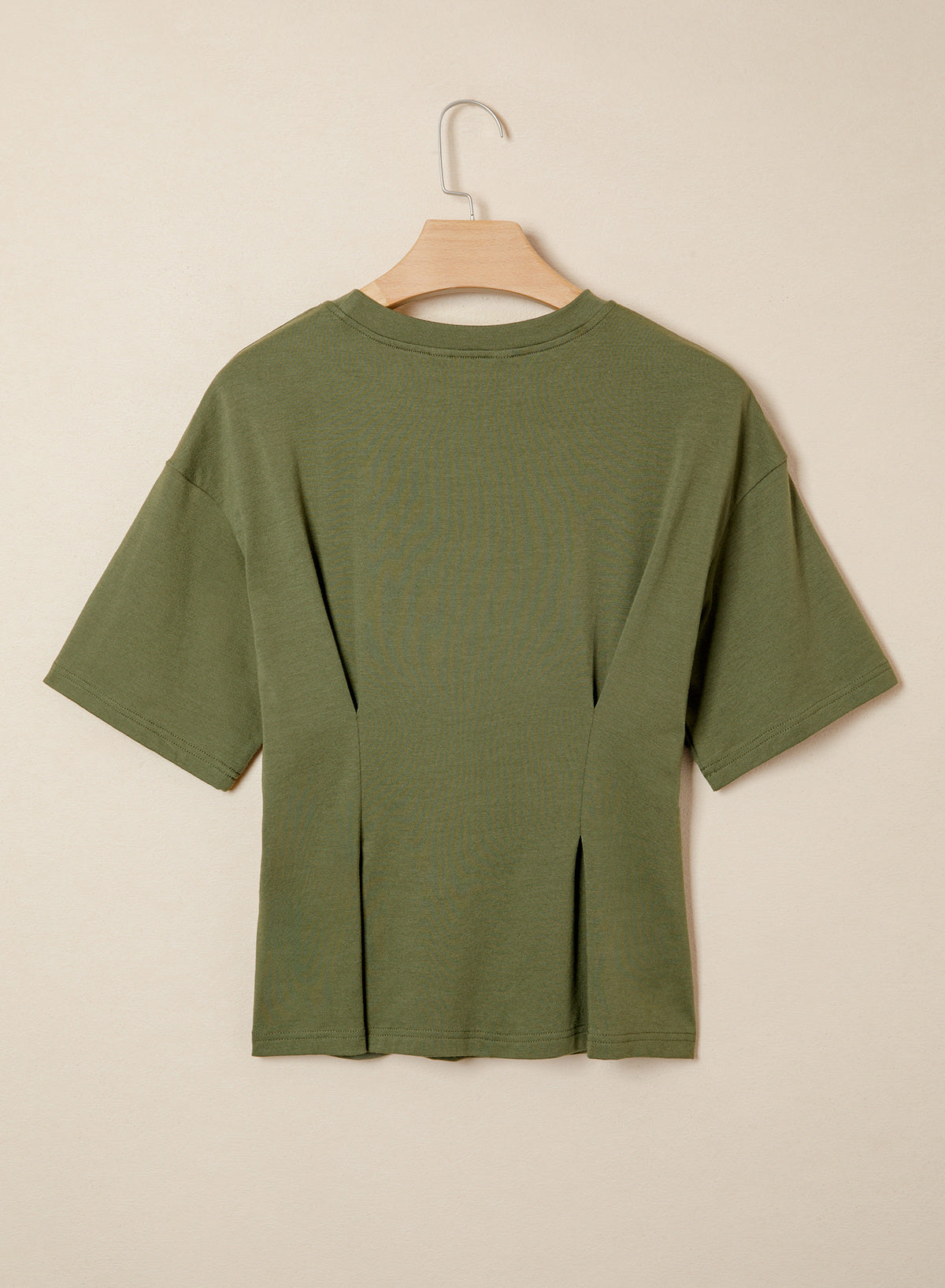 Camiseta tipo peplum con cintura ceñida y mangas 3/4 para uso casual en la oficina