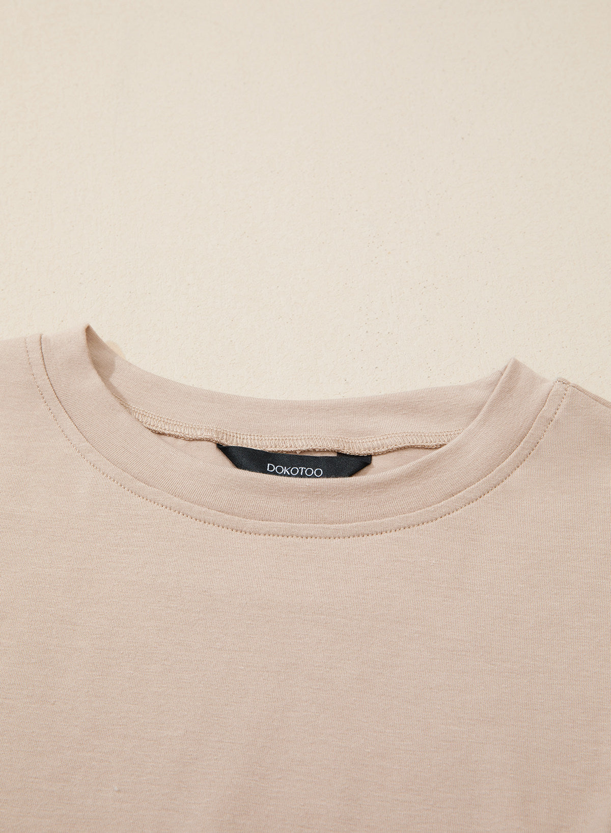 Camiseta tipo peplum con cintura ceñida y mangas 3/4 para uso casual en la oficina