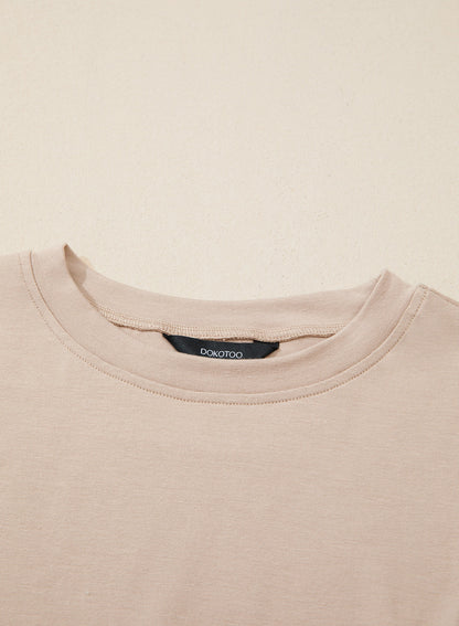 Camiseta tipo peplum con cintura ceñida y mangas 3/4 para uso casual en la oficina