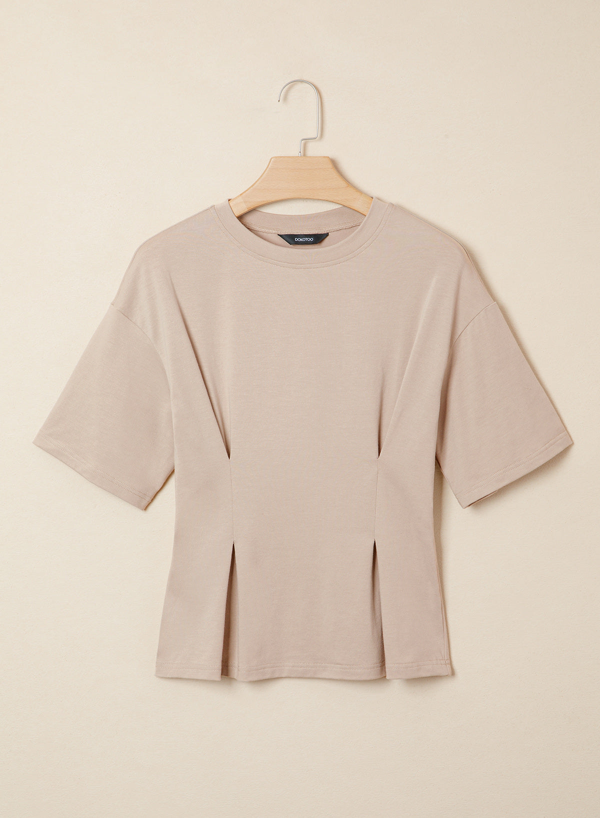 Camiseta tipo peplum con cintura ceñida y mangas 3/4 para uso casual en la oficina