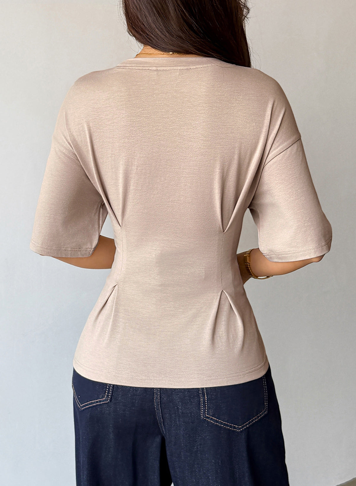 Camiseta tipo peplum con cintura ceñida y mangas 3/4 para uso casual en la oficina