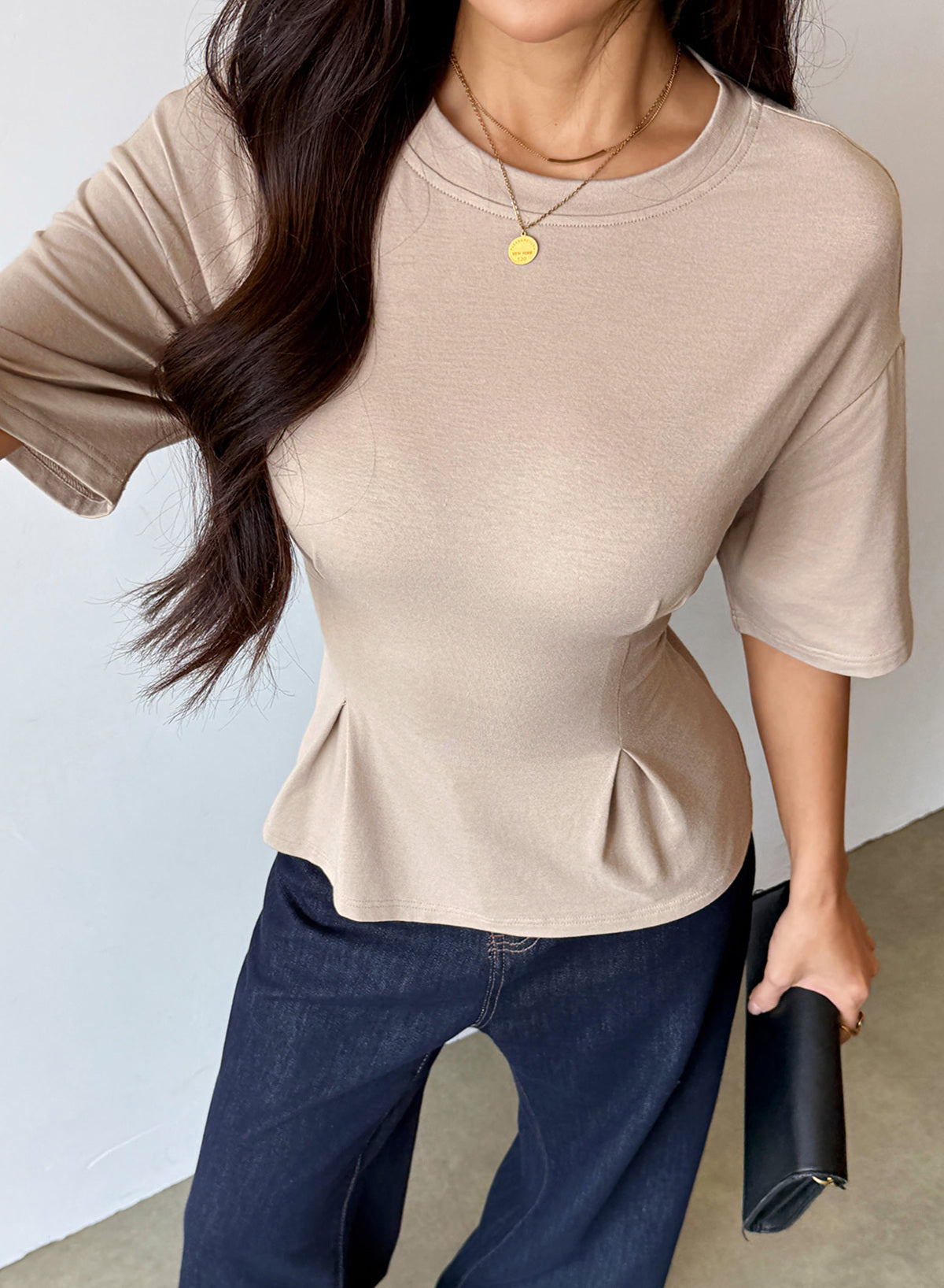 Camiseta tipo peplum con cintura ceñida y mangas 3/4 para uso casual en la oficina