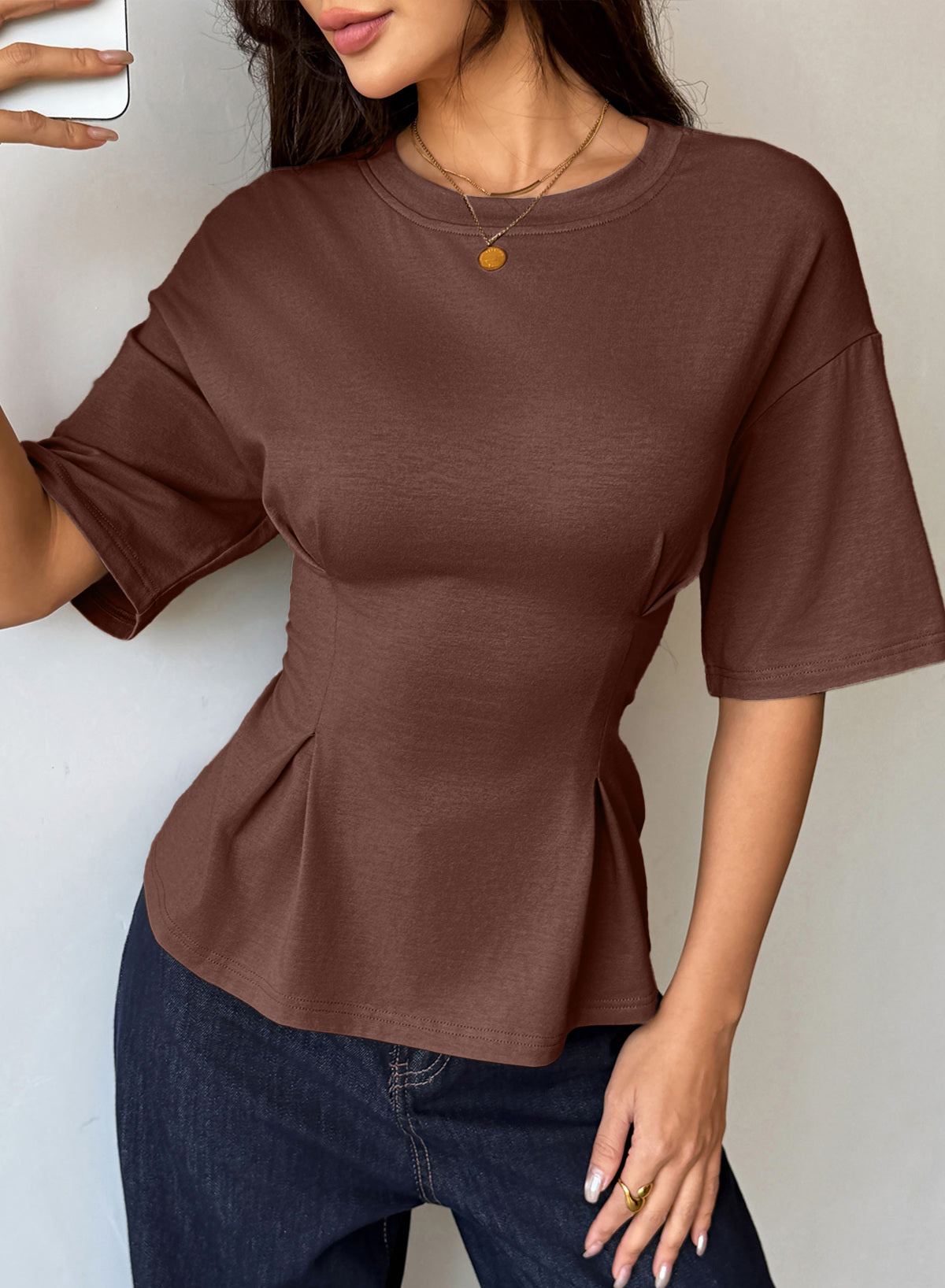 Camiseta tipo peplum con cintura ceñida y mangas 3/4 para uso casual en la oficina