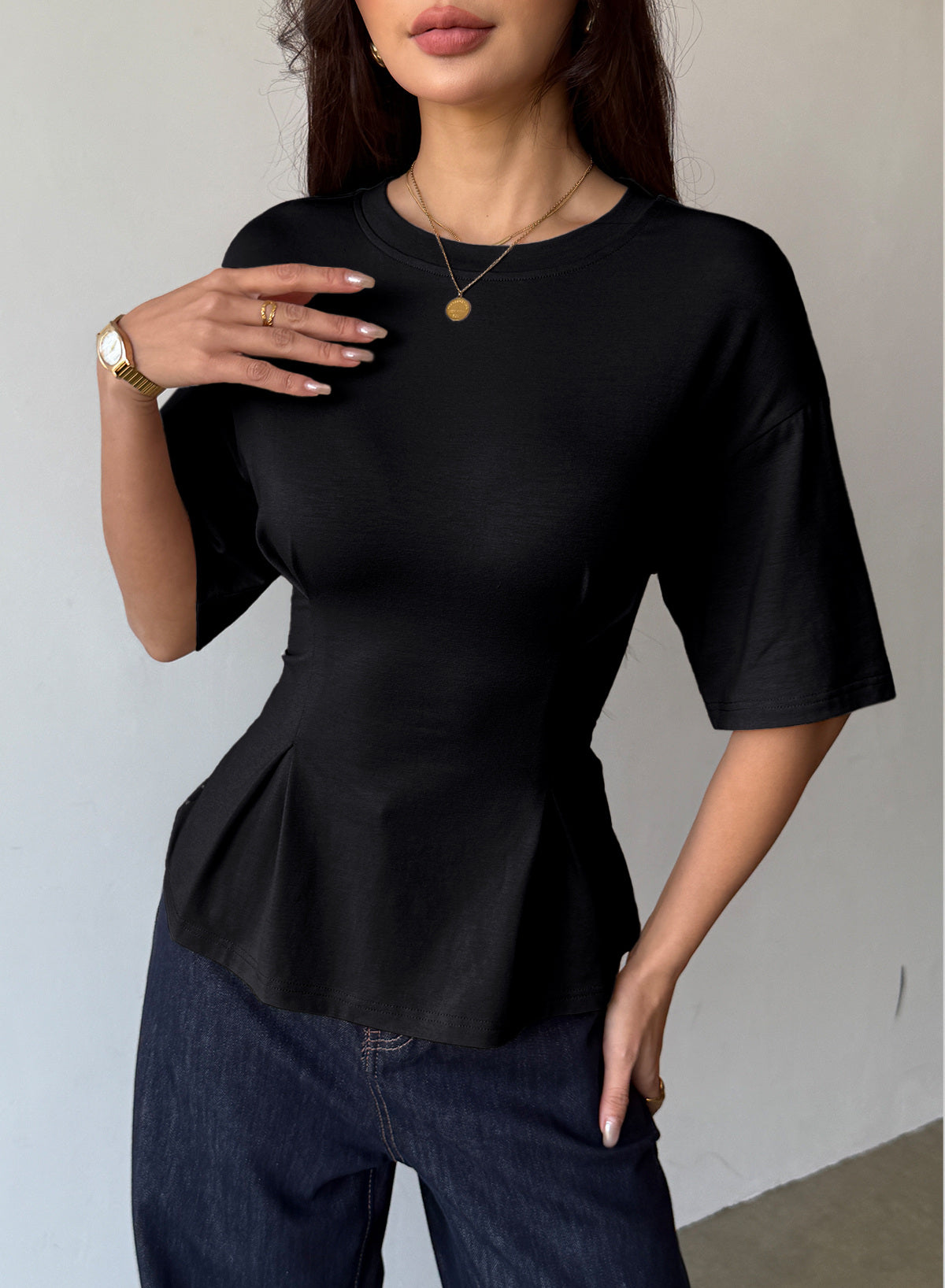 Camiseta tipo peplum con cintura ceñida y mangas 3/4 para uso casual en la oficina