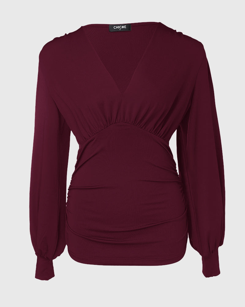 Blusa de escote en V profundo con mangas farol fruncidas, de estilo casual y ajuste entallado