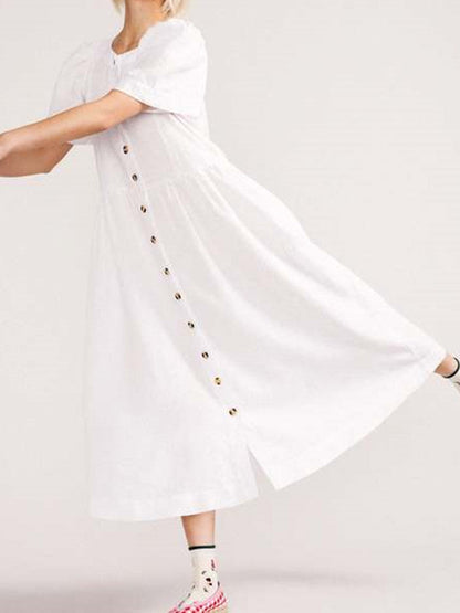 Vestido midi de lino blanco abotonado con escote en V y un bolsillo práctico