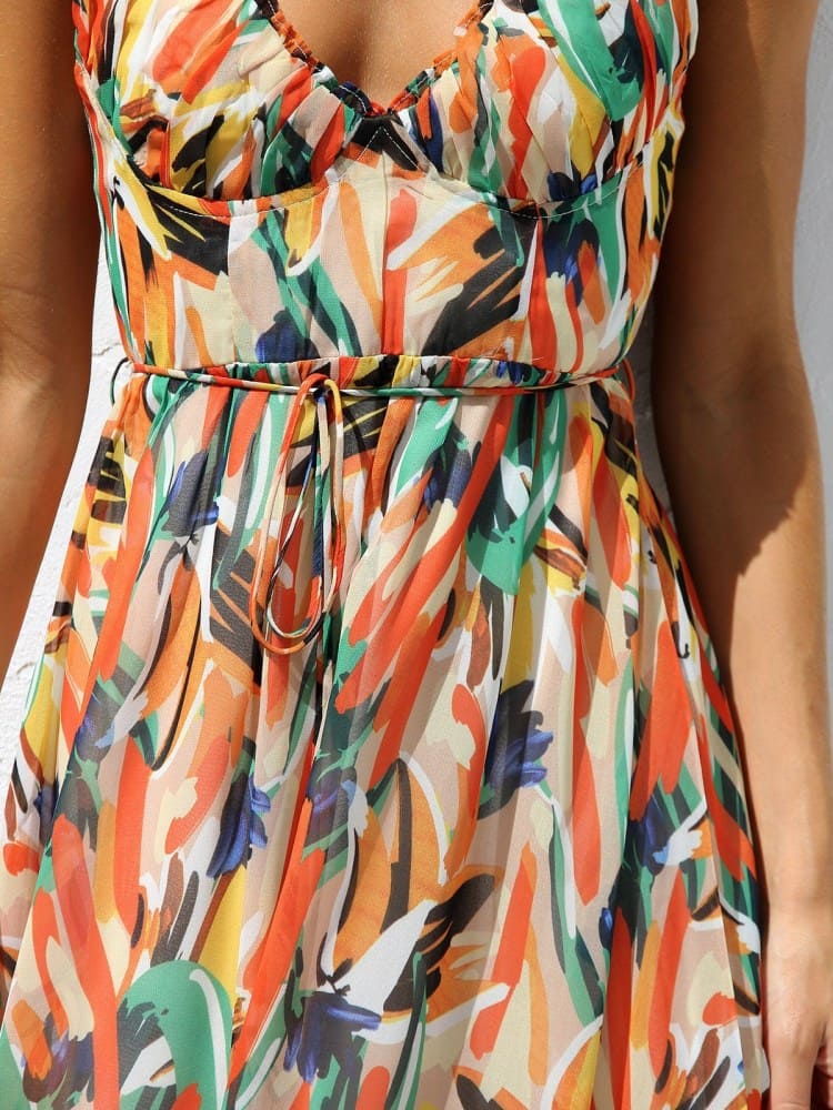 Vestido midi sin mangas con estampado floral y ribete de volantes delicados