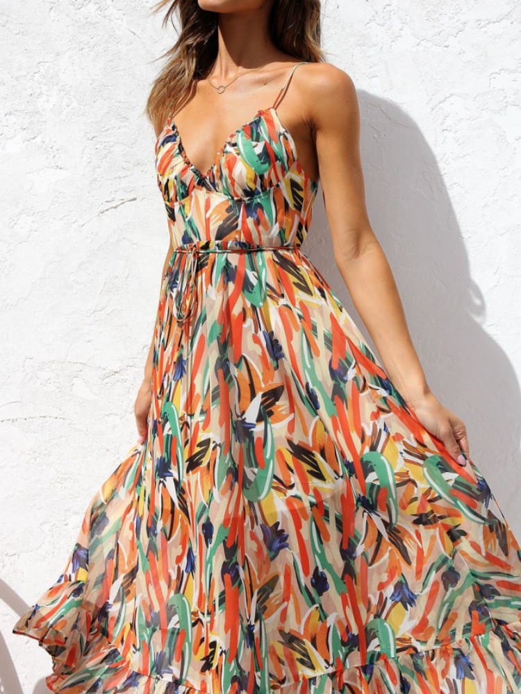 Vestido midi sin mangas con estampado floral y ribete de volantes delicados